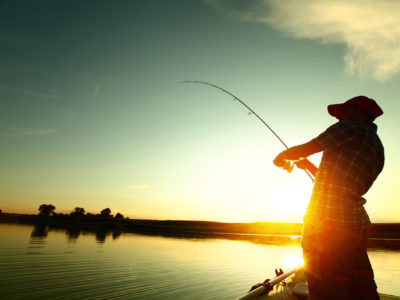 Man Fishing Inshore, With Sun.