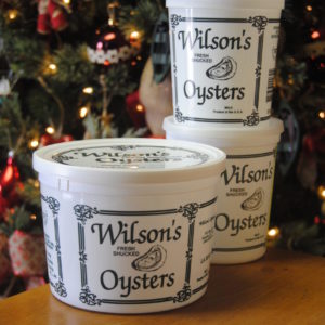 Photo Of Wilson's Oysters Containers In Front Of Christmas Tree