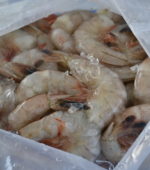close up photo of frozen shrimp in box
