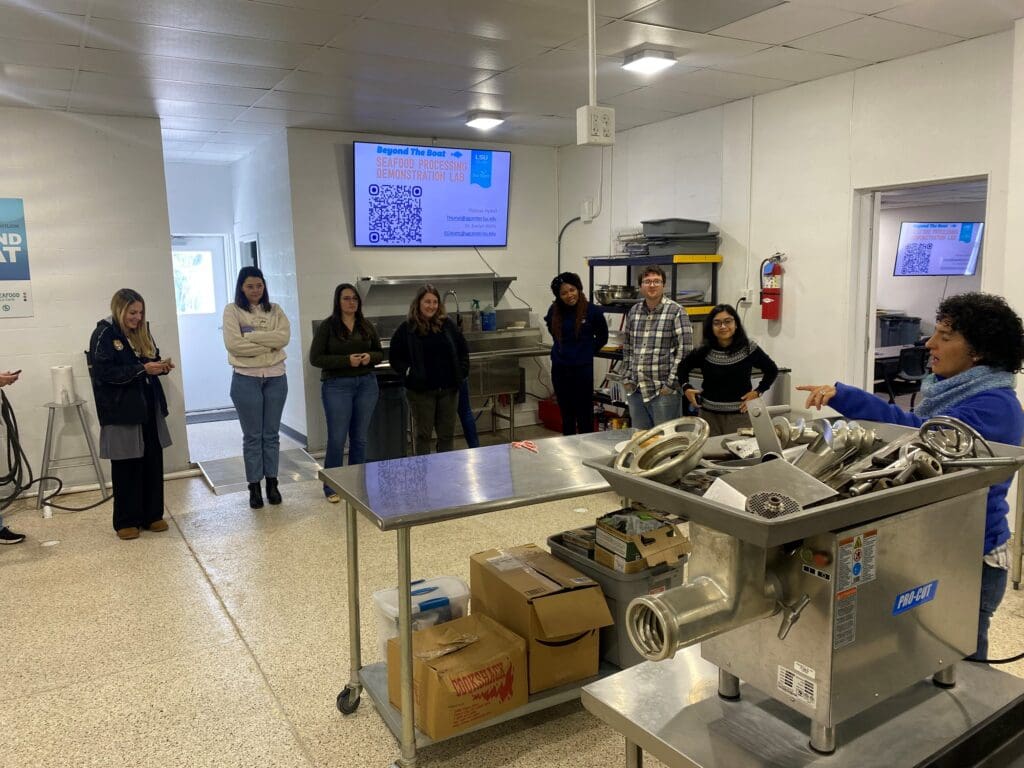 people standing in a lab with equipment