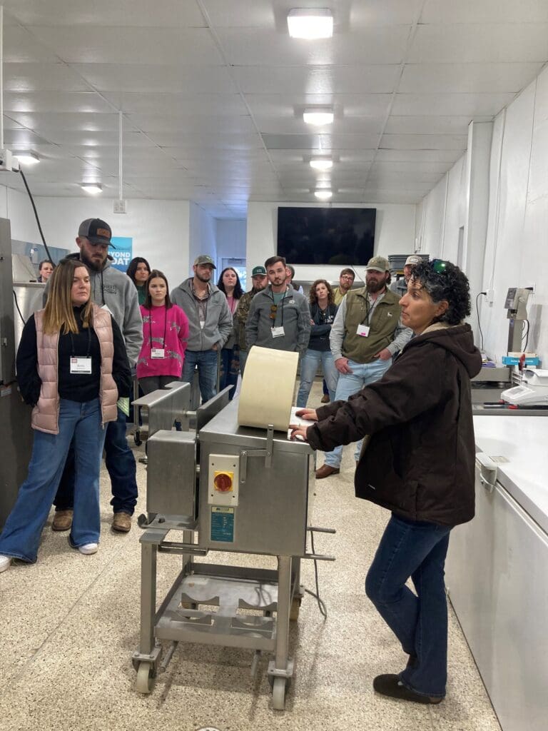 mechanical deboner equipment display to a group of people in a lab environment